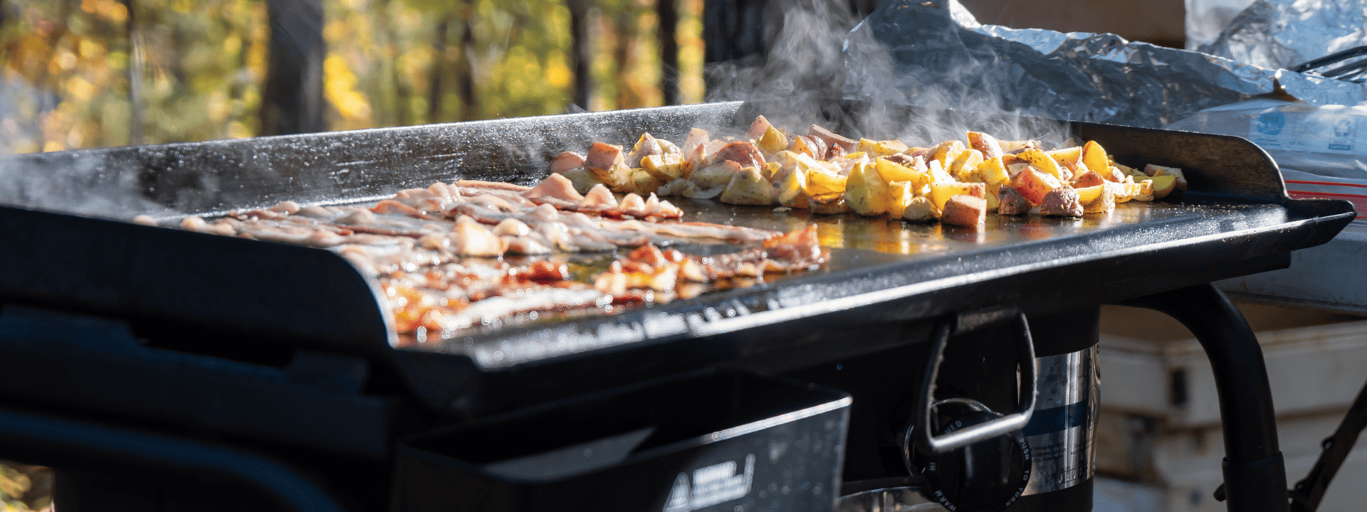 food cooking on a griddle outdoors