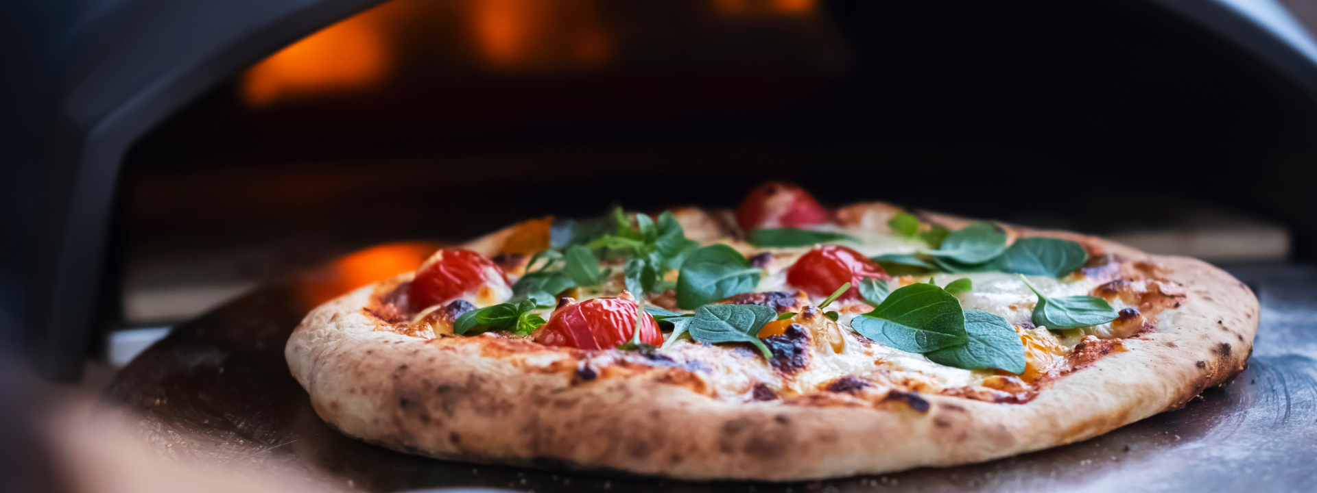 pizza inside of a pizza oven