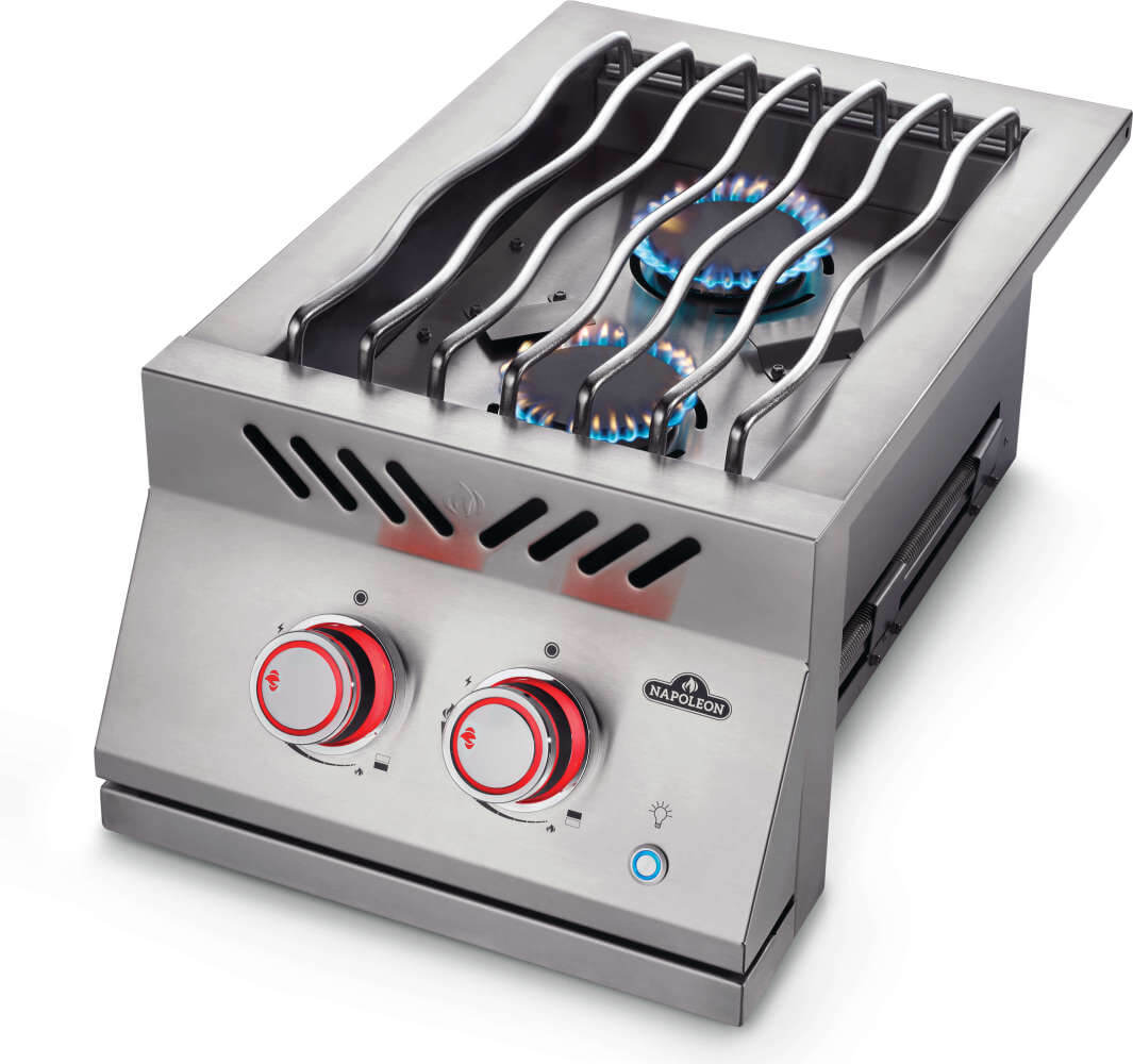 Napoleon 700 Series 12-Inch Built-in Inline dual range side burner with the burners on and knobs lit red - Angled View