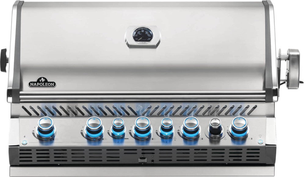 Napoleon Built-In Prestige Pro 665 Gas Grill, built into a stainless steel outdoor kitchen unit, featuring chrome accents and LED Spectrum NIGHT LIGHT Control Knobs for an outdoor kitchen.