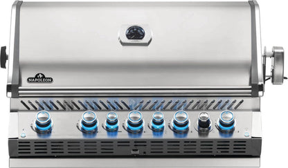 Napoleon Built-In Prestige Pro 665 Gas Grill, built into a stainless steel outdoor kitchen unit, featuring chrome accents and LED Spectrum NIGHT LIGHT Control Knobs for an outdoor kitchen.