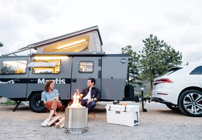 Two People Sitting By the Solo Stove Ranger Fire Pit with Stand - Lifestyle Image