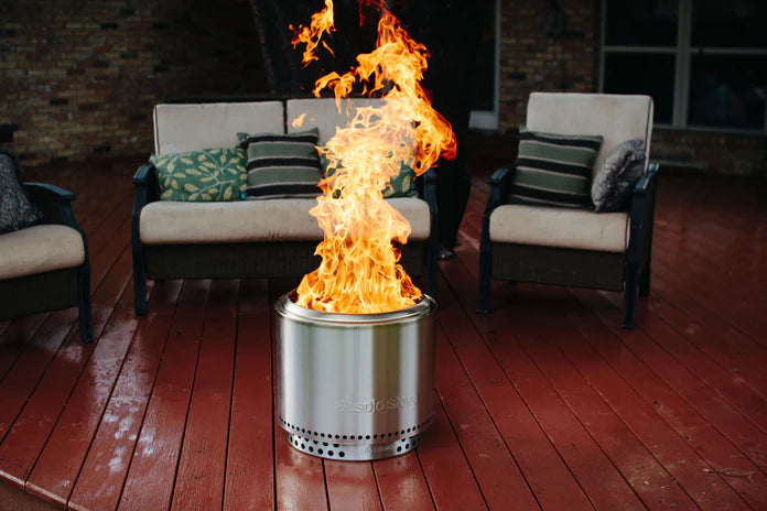 Solo Stove Bonfire Fire Pit on a red deck