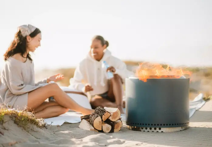 wo girls at the beach with the Solo Stove Bonfire + Stand - Lifestyle Image