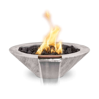 A 24-inch round wood grain concrete gas fire and water bowl with a lit flame in the center, finished in a off white color with lava rocks.